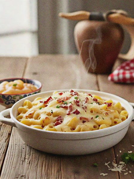 Creamy urner alpermagronen pasta dish with toppings